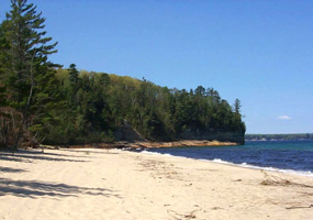 Miners Beach extends for one mile on Lake Superior where waves roll in to polish beach cobbles.&nbsp;