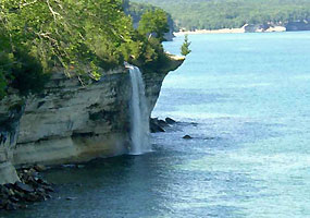 Spray Falls plunges over the Pictured Rocks directly into Lake Superior.