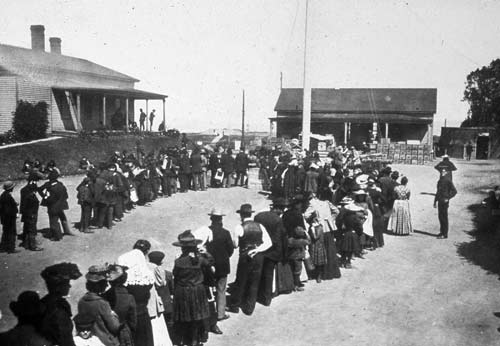 Civilians line up for relief supplies