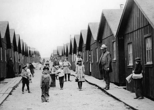 Refugees outside earthquake cottages