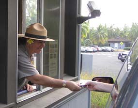 A park visitor is greeted at the entrance station.