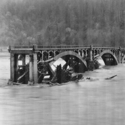 Destroyed bridge over river
