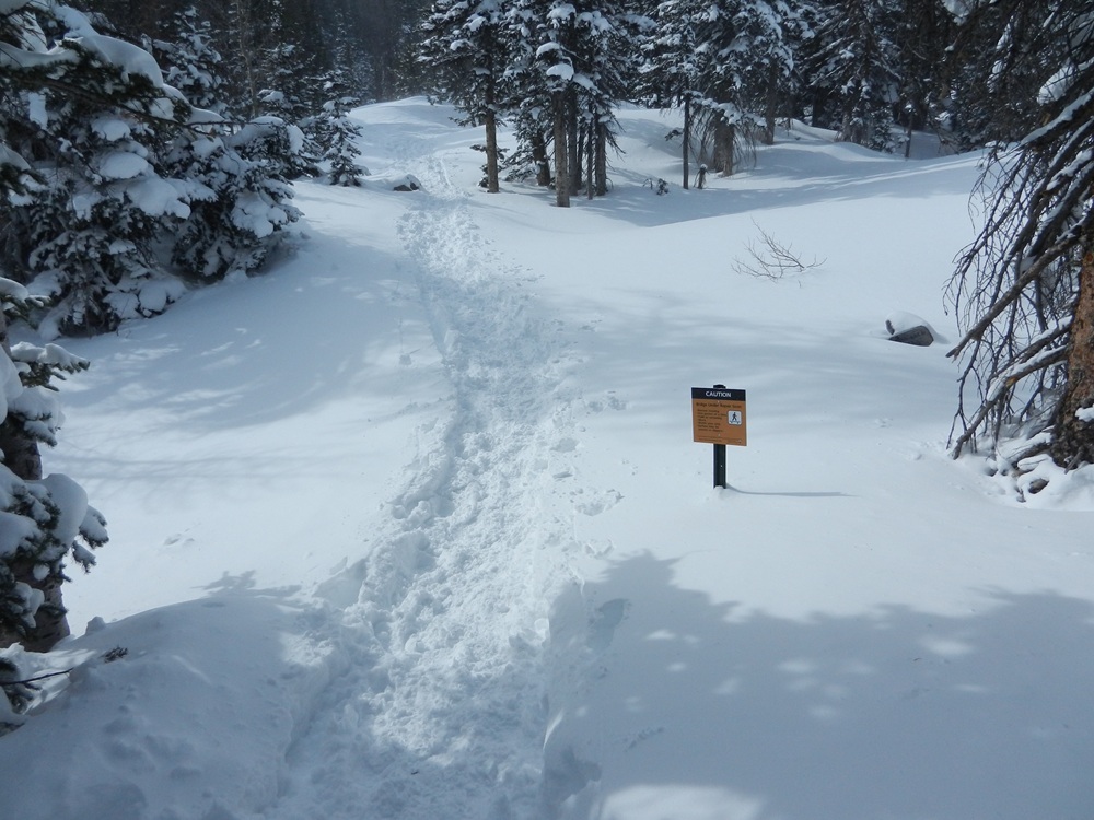 Snow on trail between Nymph and Dream Lakes