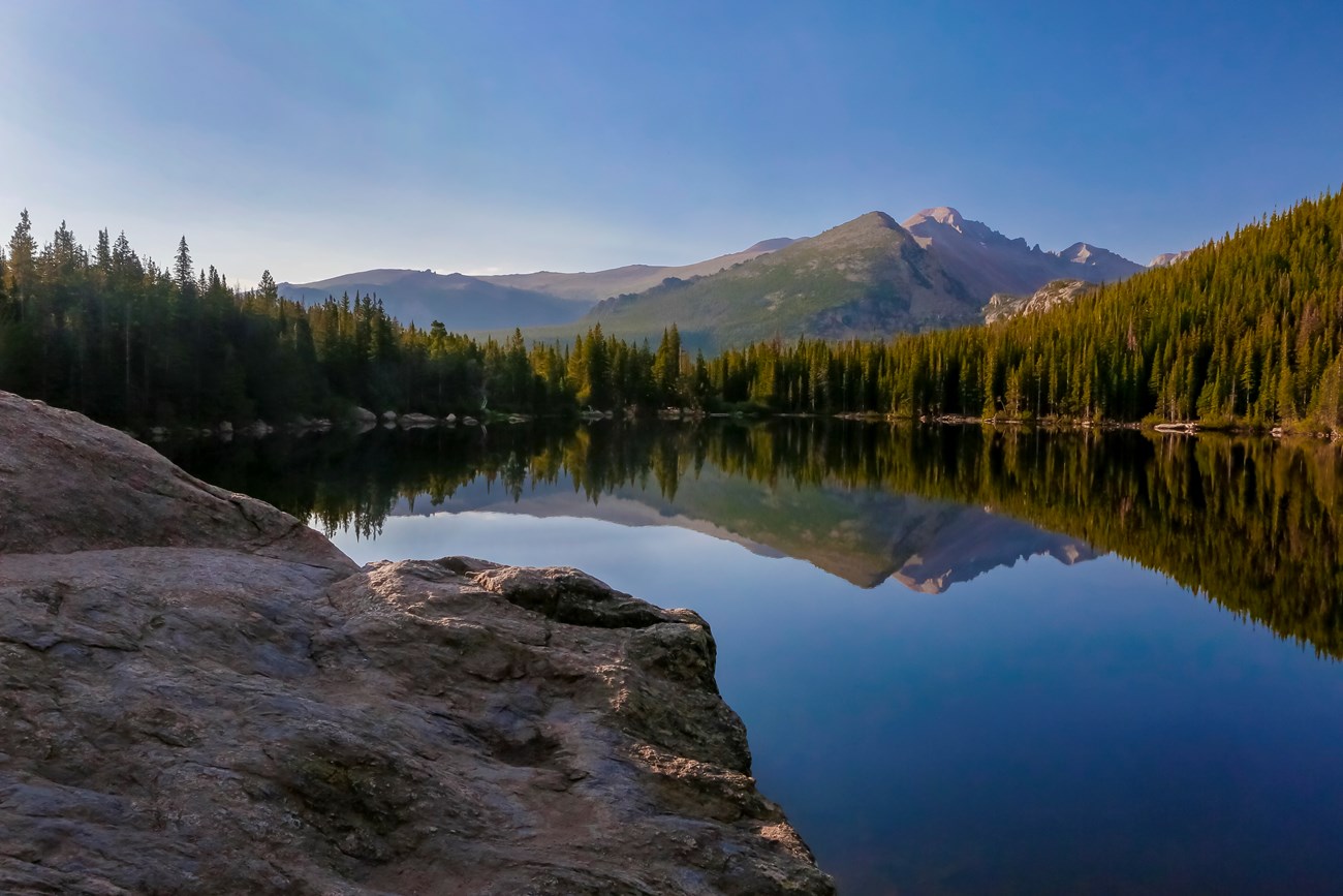 View of mountain peaks seen across Bear Lake in summer