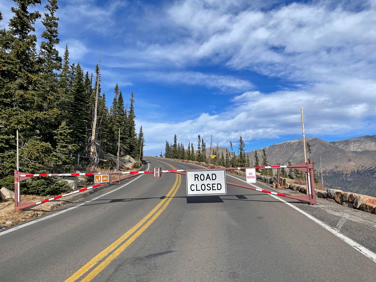 A Road Closed gate is closed on Trail Ridge Road a Rainbow Curve