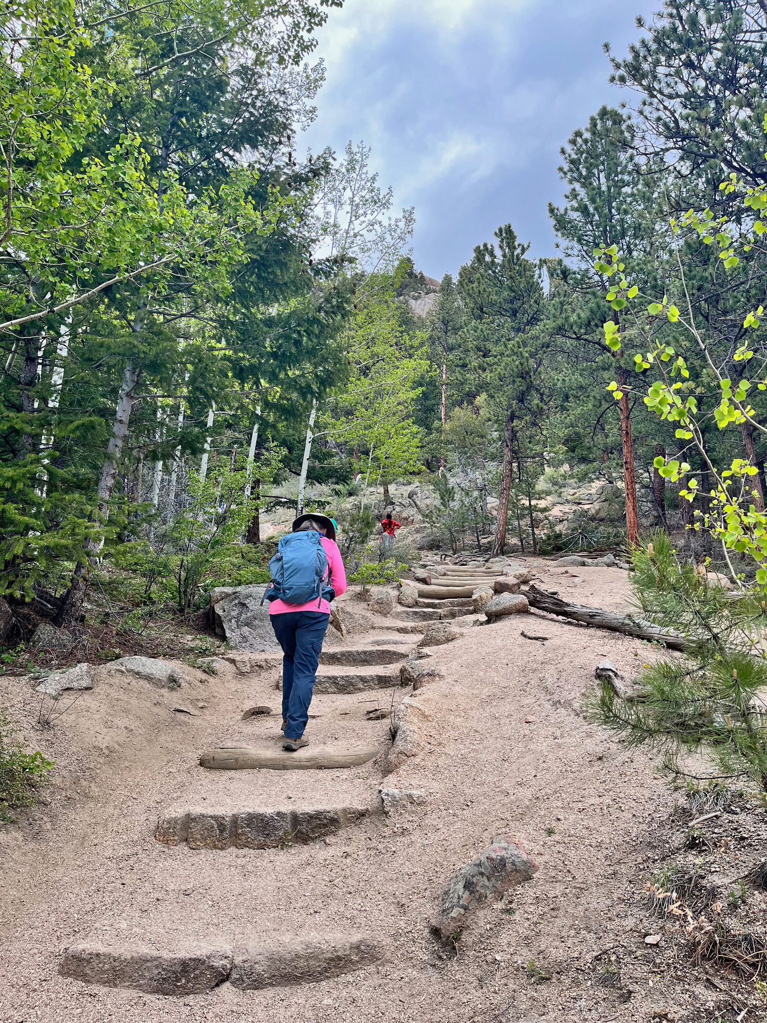A person is hiking up the Gem Lake Trail