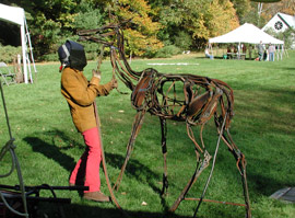 Sculptor, Wendy Klemperer, welding an iron sculpture of a deer during the Sculptural Visions event in 2006