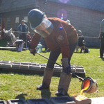 A member of the Iron Guild pouring molten iron into moulds