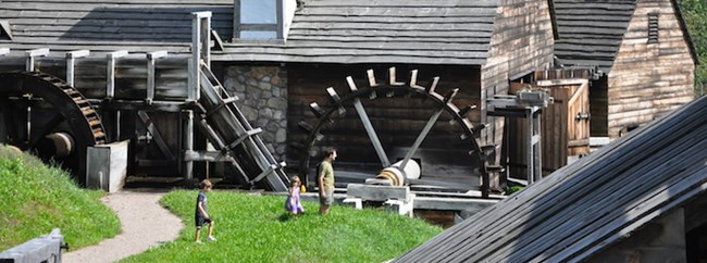 Family in Front of Water Wheel