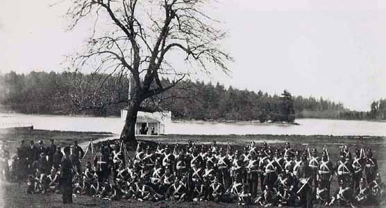 Royal Marines pause for a photo after an afternoon parade in the early 1870's. The blockhouse is in the background.