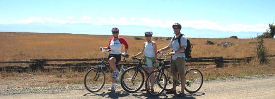 Cyclists pause to enjoy the view on the Redoubt Road at American Camp