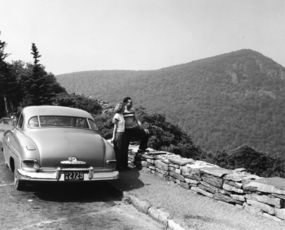 A couple pausing to take in a scenic view from Skyline Drive.