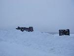 Big Medaows signs nearly covered by snow.