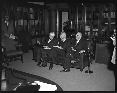 Photograph shows Lincoln scholars including Carl Sandberg (left) seated on a couch, during the Abraham Lincoln Sesquicentennial at the Library of Congress