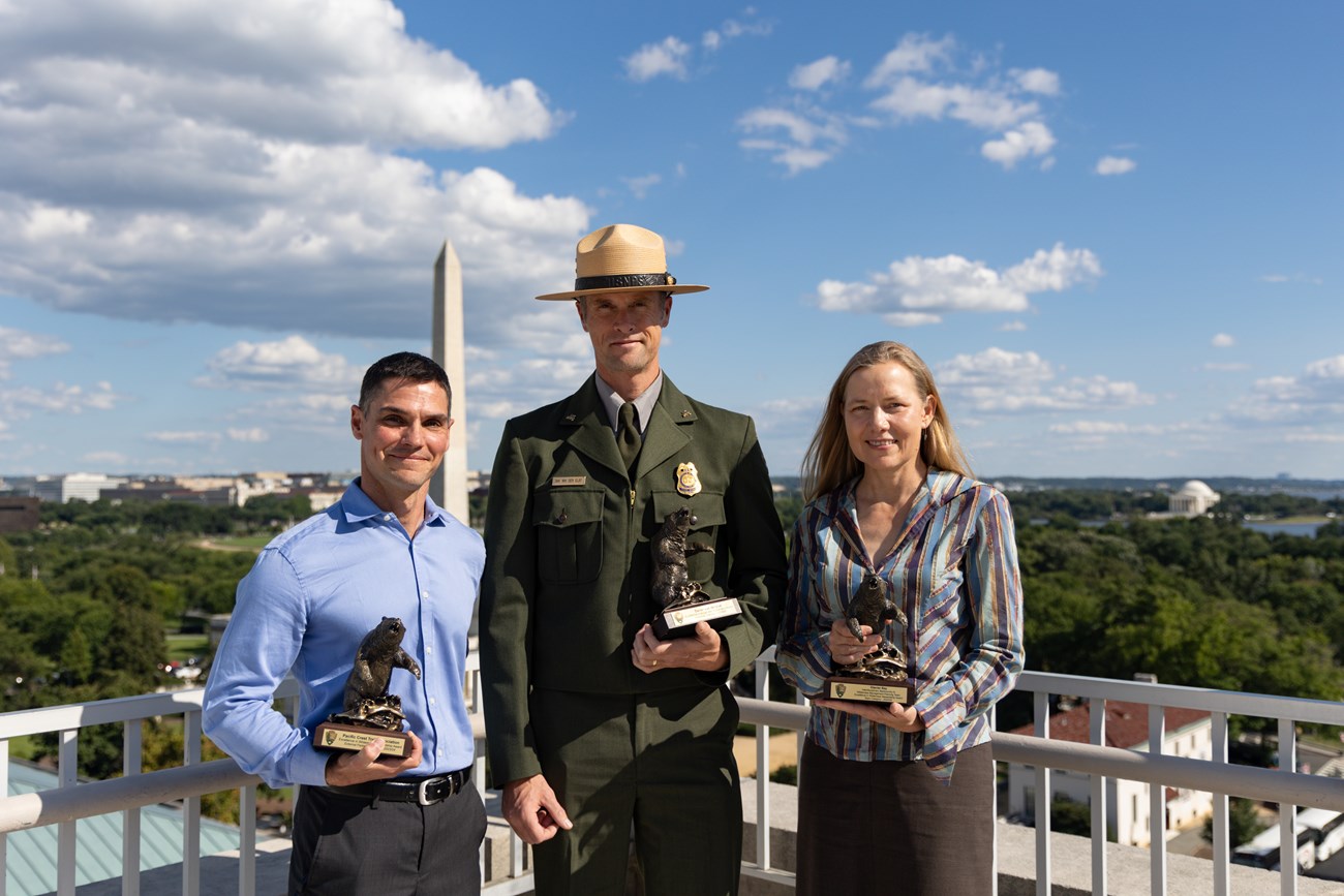 The 2023 Wilderness Stewardship Award recipients receive their bronze statues.