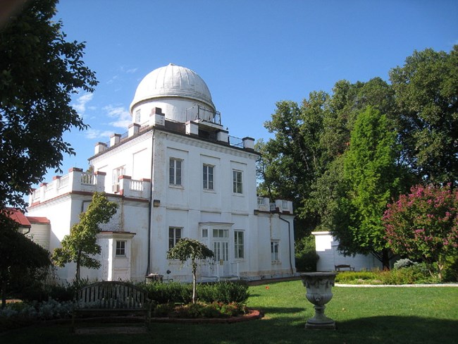 Modern photograph of the Georgetown University Astronomical Observatory, a white square building with a large white dome.