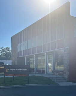 Image of a brick building with a sign reading Public Safety.