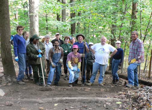 Volunteers pose for pictures