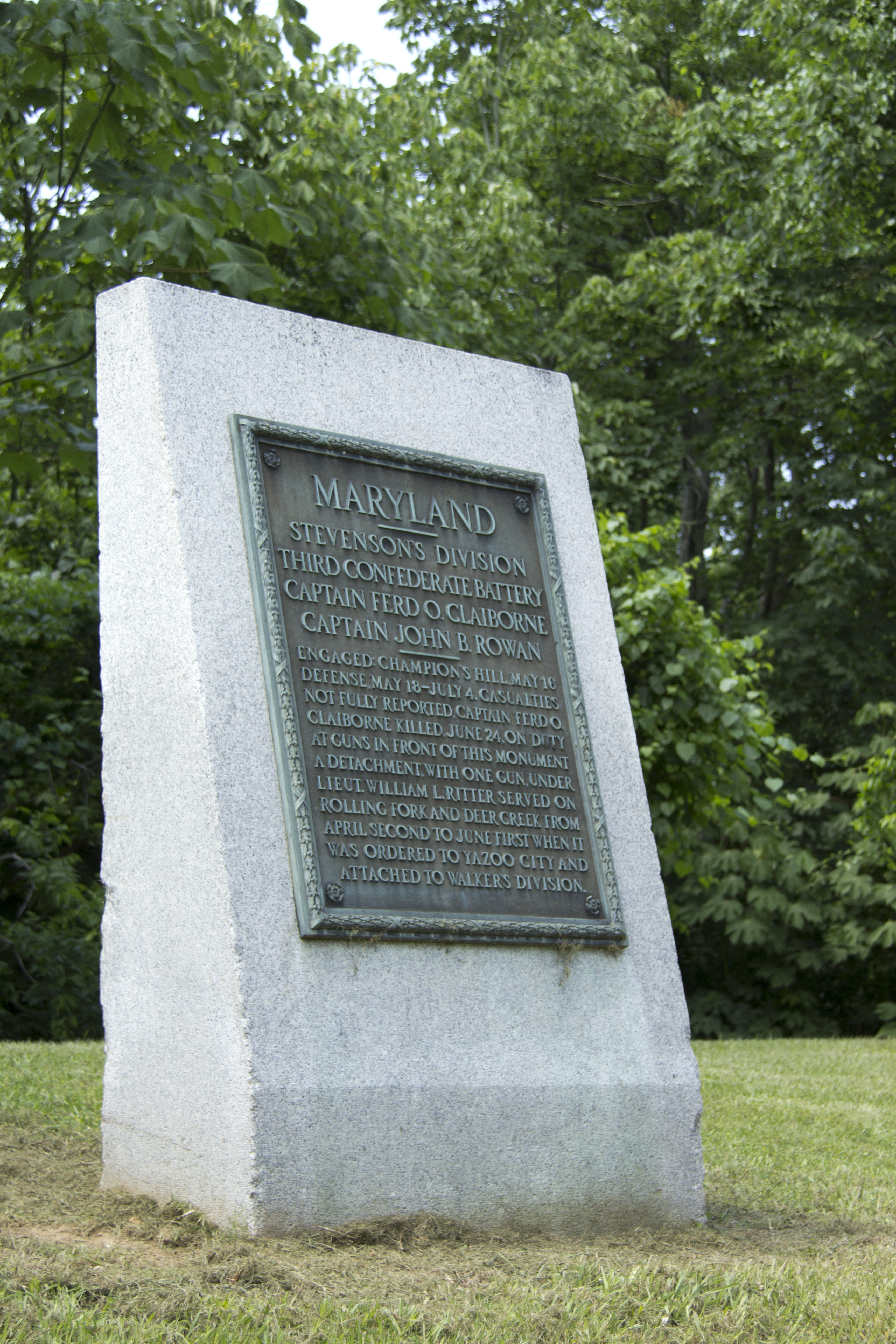A bronze tablet on a piece of stone