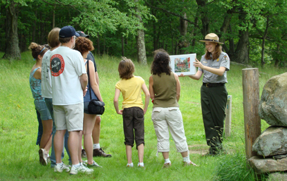A ranger led tour in the fields of Weir Farm National Historic Site.