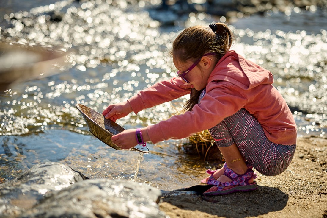 A girl panning for gold