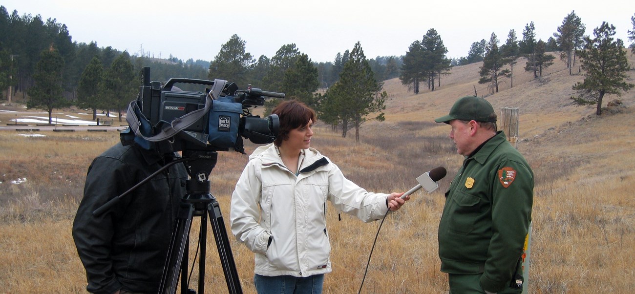 Wind Cave's Park Biologist gives an interview to a television reporter.
