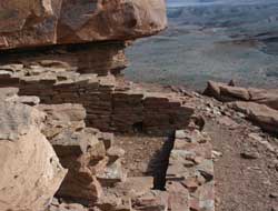 pueblo walls, far above surrounding grasslands.