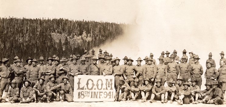 Members of the 18th Infantry 941 in front of Old Faithful geyser, 1912.