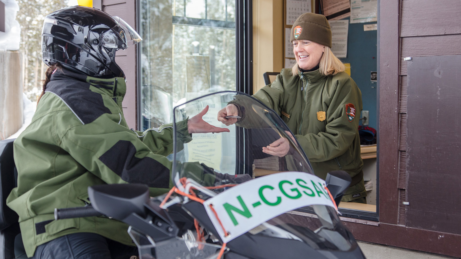 Snowmobiler at West Yellowstone Entrance Station