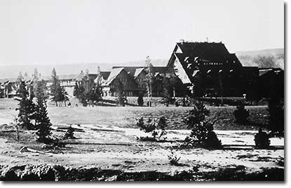 Historic black and white photo of the Old Faithful Inn.