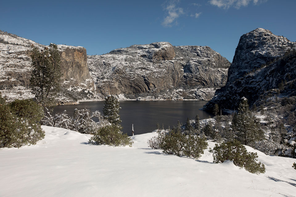 Cliffs and reservoir at Hetch Hetchy covered in snow