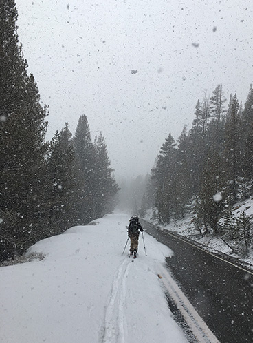 Spring snowfall on April 14, 2021 with skier.