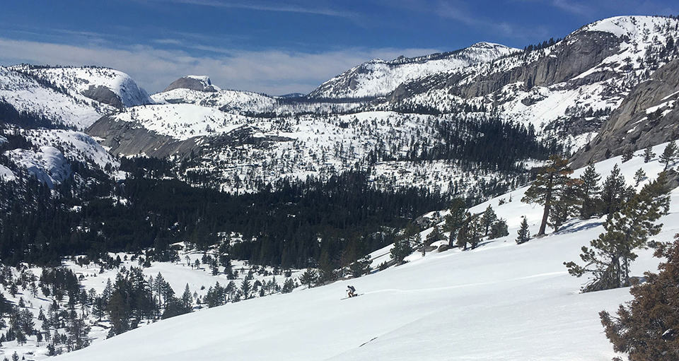 Skier, Merced Canyon, and Half Dome on March 17, 2019.