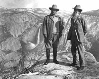 John Muir stands on Overhanging Rock with President Theodore Roosevelt