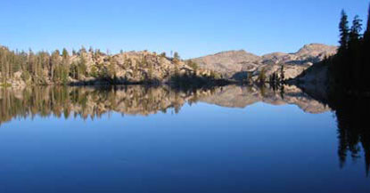 Intense blue sky and blue lake with mountain scenery