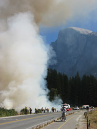 Onlookers watch smoke rises from Yosemite Valley