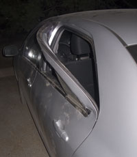 Car door pulled out by bear in search of food. Car door pulled out by bear in search of food.