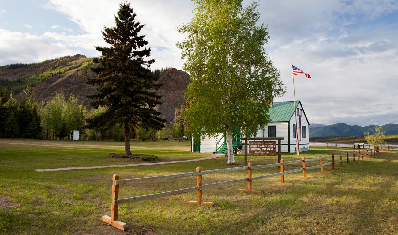 Eagle Bluff and the Yukon River are the backdrop for Park Headquarters in Eagle, Alaska