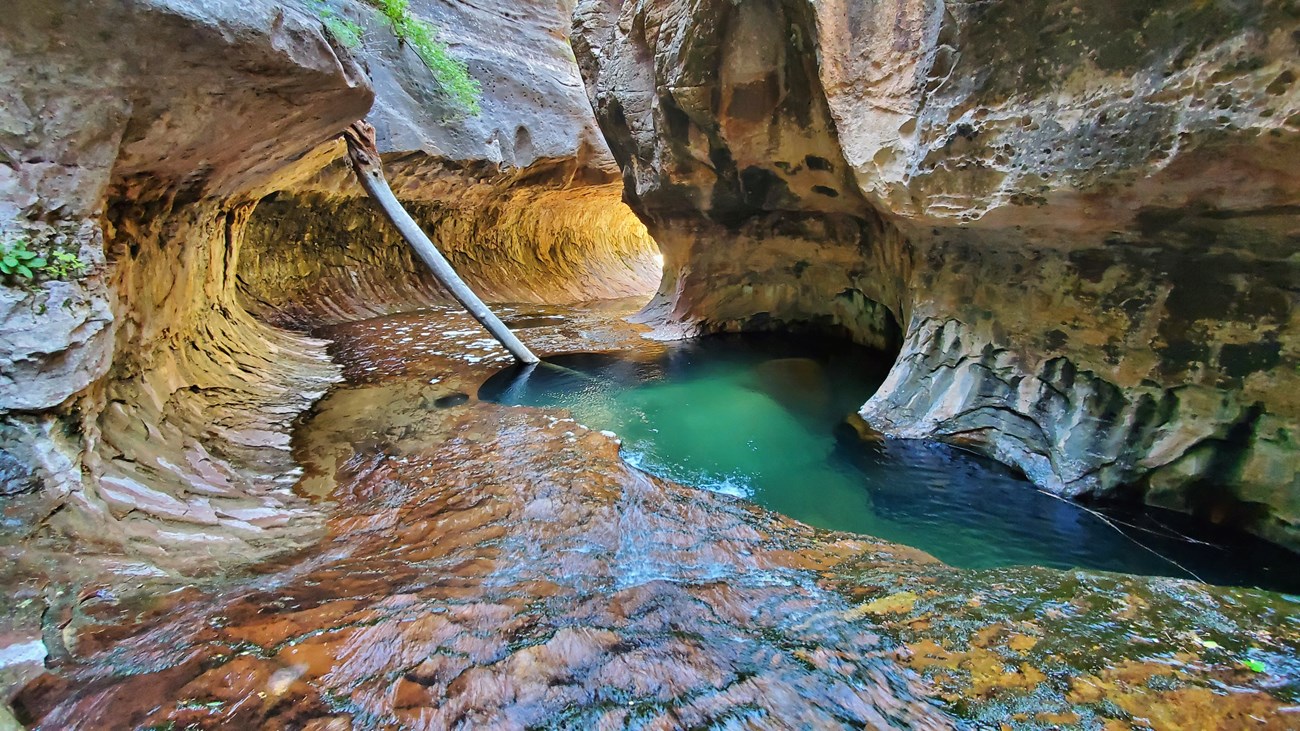 Gold canyon with colorful pool