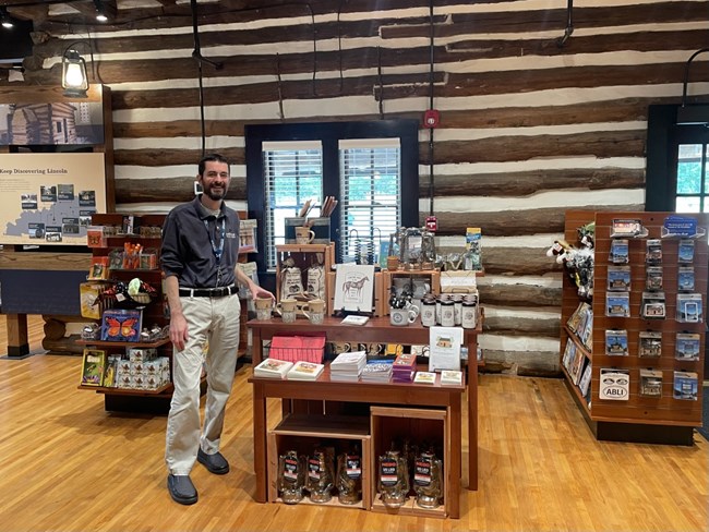 shopping area with smiling staff member