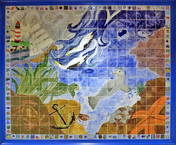Ceramic mural of ocean scene with a seal, eider ducks, ship, and lighthouse. Made up of individual tiles made by students.