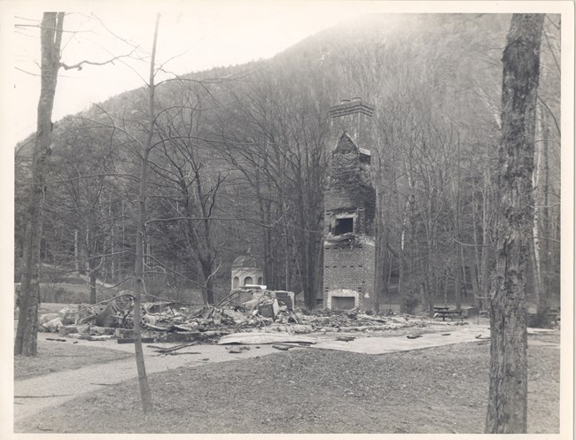 Historic photograph of fire damage and remaining chimney