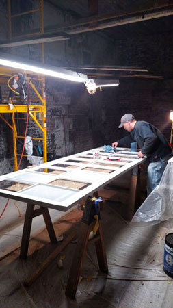 man working at construction table