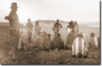 Armed soldiers guarding the Hopi prisoners in desert, 1894