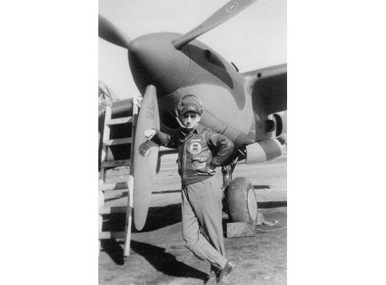Kenneth Ambrose standing next to his plane