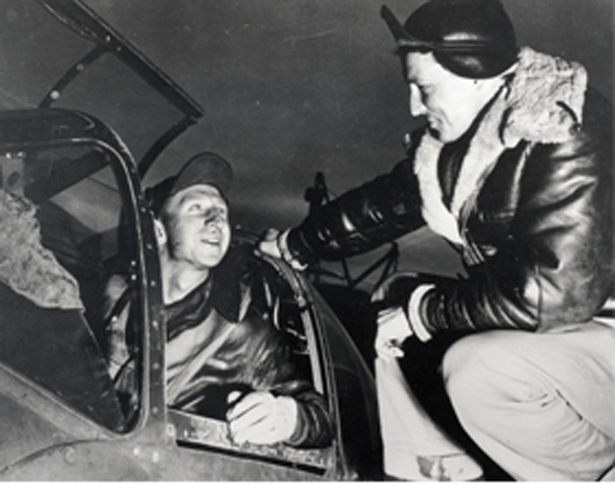 Jack Channualt congratulates Lt. Kenneth Ambrose