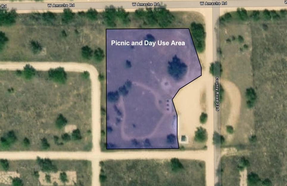 Zoomed in map of park entrance area. A large purple polygon to the left of the entrance road marks the picnic and day use area.