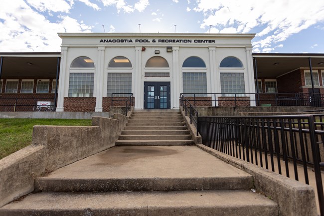 A large building with an Ancostia Park Pool written on it.