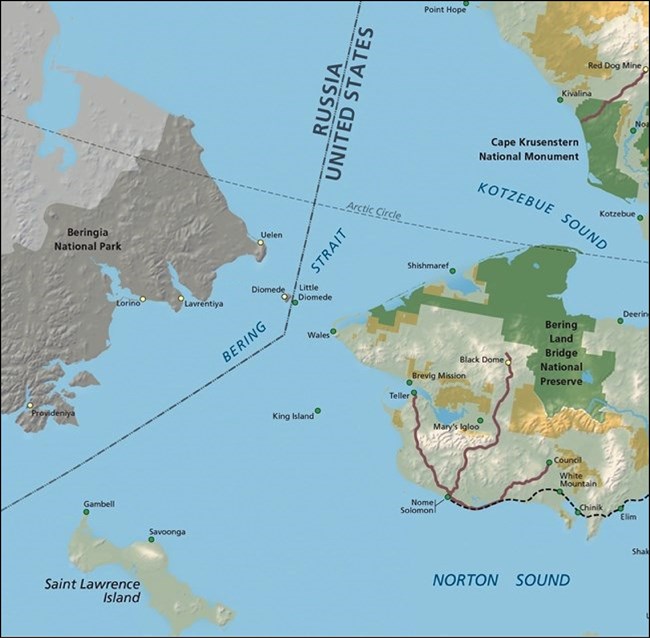 Greyed out landmass (Russia) and Western Alaska with a line between them labeling the international border. Centered on two small islands, Diomede (Russia) and Little Diomede (Alaska).