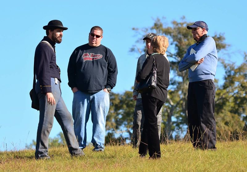 Civil War reenactor with park visitors